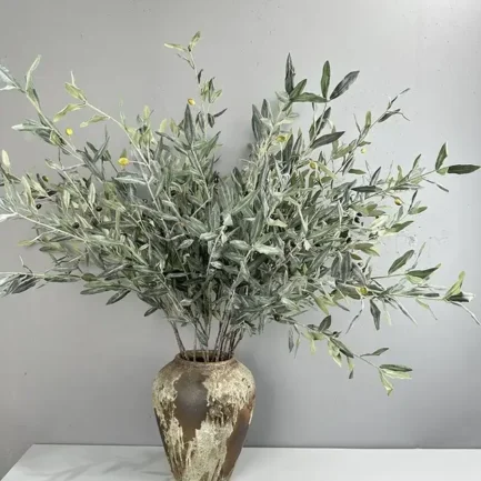 an olive branches in a vase